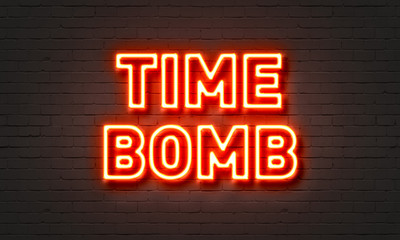 Time bomb neon sign on brick wall background.