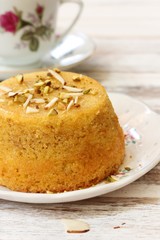 Gluten free Almond cornmeal cake topped with nuts, selective focus