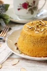 Gluten free Almond cornmeal cake topped with nuts, selective focus
