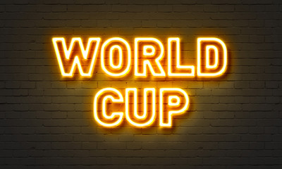 World cup neon sign on brick wall background.