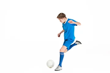 Kussenhoes Young boy with soccer ball doing flying kick © master1305