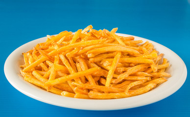 Fried potato chips on plate,closeup shot.