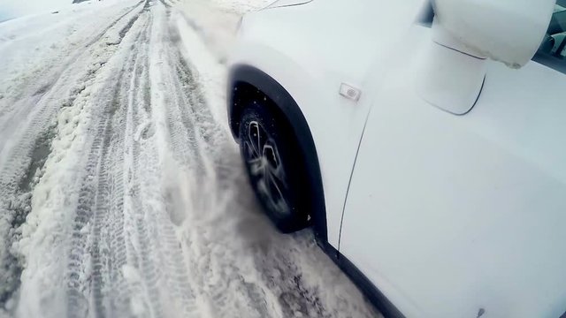 Tires, wheels driving through heavy snow. Slow motion. On board camera. HD