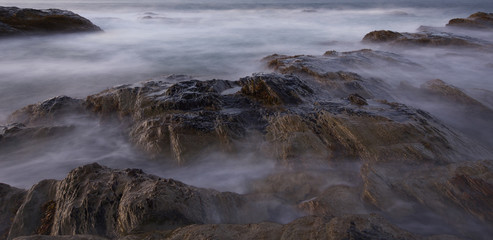Misty rocks by the sea