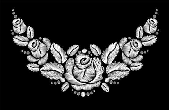 White roses embroidery on black background.