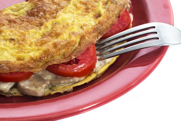 Omelet on a colored plate over white background