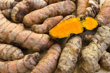 Fresh turmeric roots and one slice