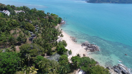 Fototapeta na wymiar Aerial view of sea coastline and island with palm trees in Phuket, Thailand