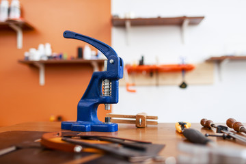 Leathercraft stapler and other tools on workplace