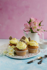 Yellow cupcakes spring in style on a pink background