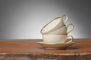Vintage Tea Cups on a wooden Table - Gray Background - Horizonzal, Simple Studio Still-life
