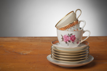 Vintage Tea Cups on a wooden Table - Gray Background - Horizonzal, Simple Studio Still-life