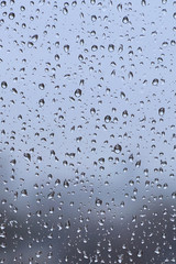 Water drops background. Water drops on glass window in rainy day.