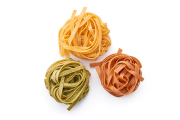 Italian pasta tagliatelle, with chilli and spinach, isolated on white background