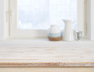 Fototapeta na wymiar Wooden table top on blurred kitchen window background
