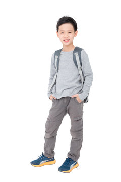 Young asian schoolboy with backpack over white background