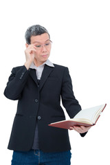 Old asian woman reading book having problem with her eyes