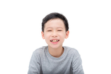 Young asian boy smiles over white background