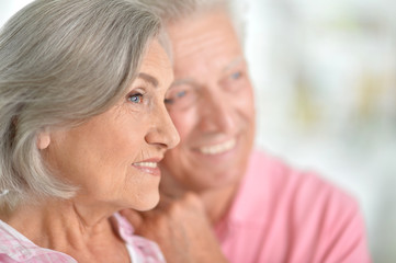 Happy elderly couple embracing