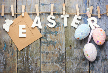 Happy Easter background with hanging Easter eggs