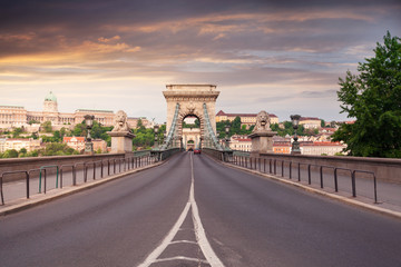 Fototapeta na wymiar Szechenyi Chain Bridge in beautiful Budapest at sunset. Bridge over the Danube River, connects the two banks of the Buda and Pest, in the capital of Hungary.