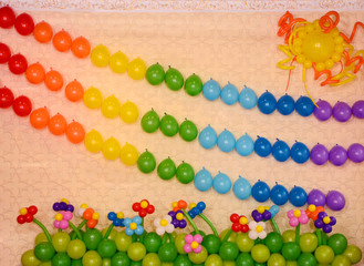 The wall is decorated with balloons. The spring holidays