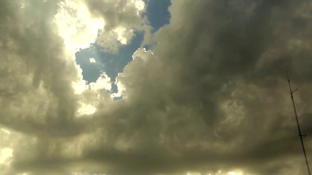 Dynamic Time-Lapse of Heavy Gray Clouds in Motion Across the Sky