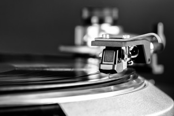 vintage turntable in action closeup black and white
