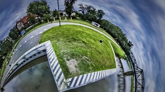Little Tiny Planet 360 Degree Edge of City Railroad Bridge Over Smooth River Reflection of Clouds in the Water Transportation of Opole Oil Spill Pollution