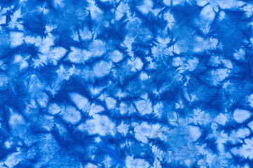 Fototapeta na wymiar Pattern of blue dye on cotton cloth, Dyed indigo fabric background and textured