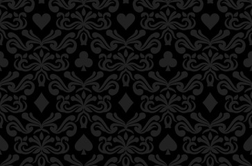 Seamless black background with poker symbols surrounded by floral ornament pattern