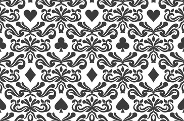 Seamless background with poker symbols surrounded by floral ornament pattern