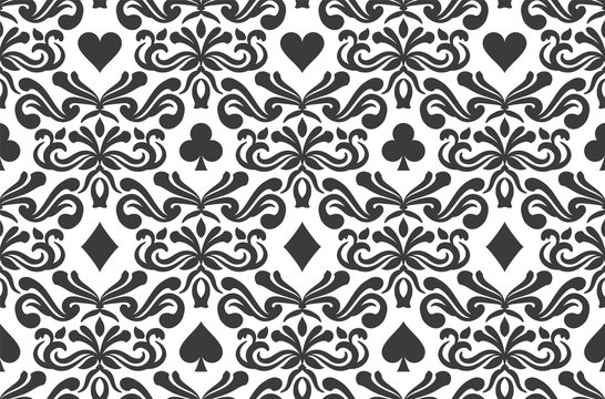 Seamless background with poker symbols surrounded by floral ornament pattern