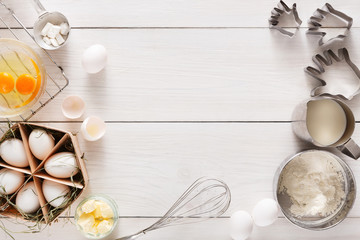 Baking ingredients on white rustic wood background, copy space