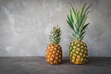 Ripe pineapples on a wooden table