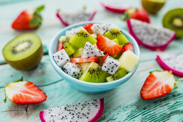 Fruit salad with dragon fruit and exotic fruits. Healthy diet and vegetarian food.