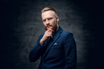 Fototapeta premium Redhead hipster male dressed in a blue jacket.