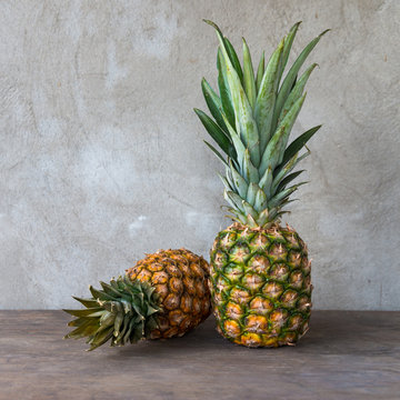 Ripe pineapples on a wooden table