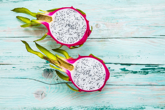 Dragon fruit, pitaja exotic fruit on wooden background.