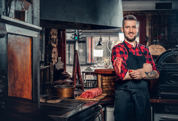 Portrait of stylish cook on a kitchen.