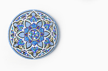 Oriental ceramic plate with beautiful colorful ornament