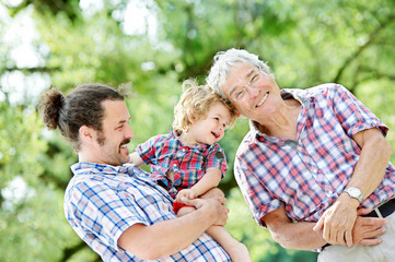 Family Generations: Father, son and Granddad, outdoors, in Nature, enjoying their Quality Time together, All in Checkered Shirts