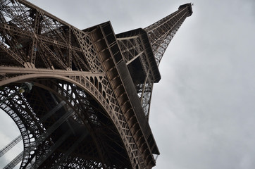 The Eiffel Tower shot from below, with its imposing iron structure