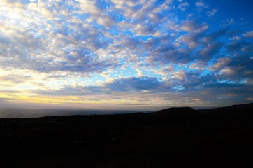 Long shot of the sunset at Puna Pau an extinct volcano where the pukaos, or moai headdresses, were...