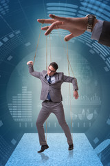 Businessman puppet being manipulated by boss