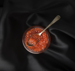 red caviar on a black background