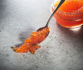 red caviar on a gray background