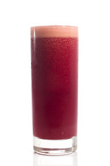 A glass of red healthy juice isolated over a white background