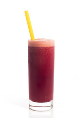 A glass of red healthy juice isolated over a white background