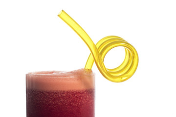 A glass of red healthy juice isolated over a white background